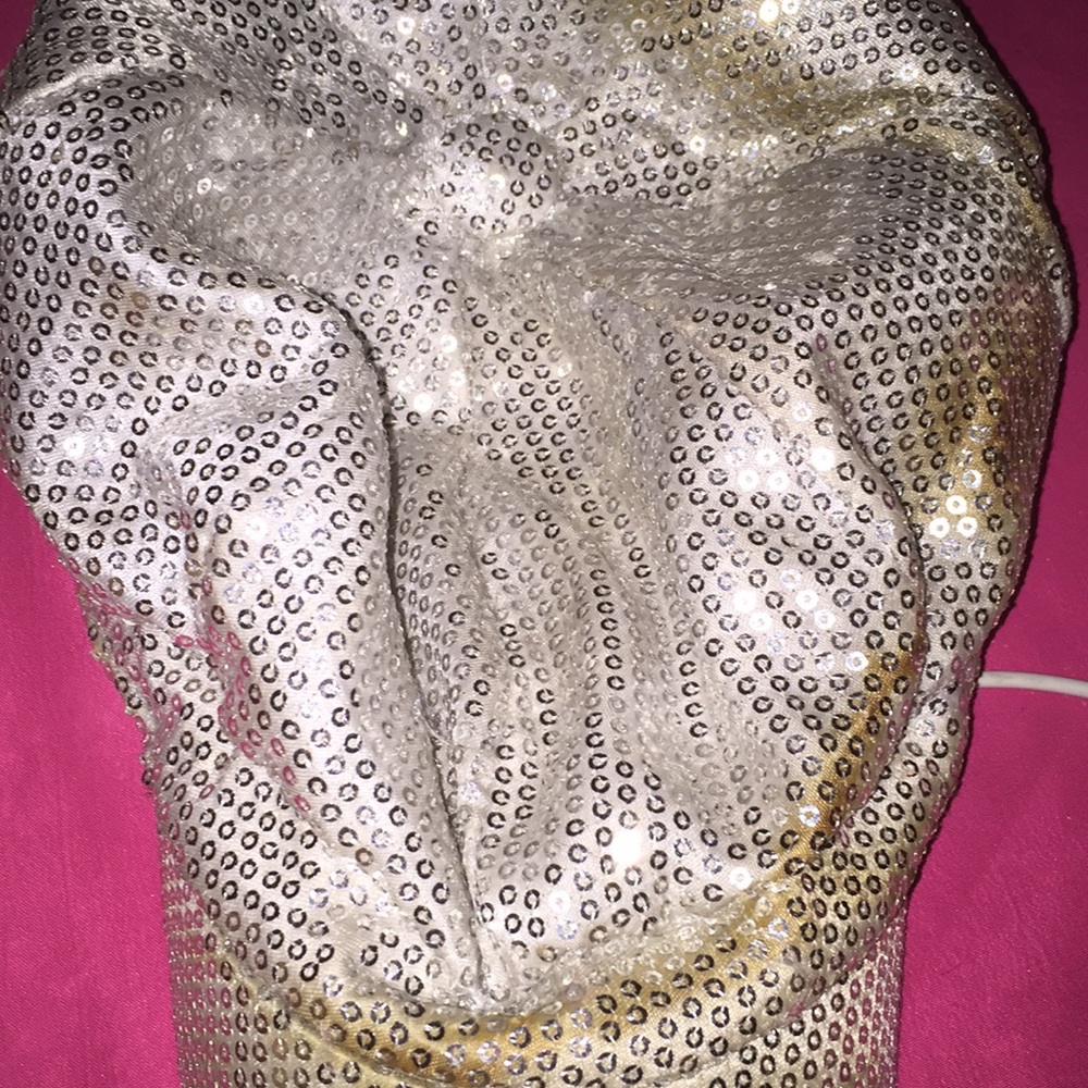 A silver and gold hat and its sequence
